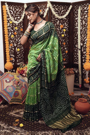 Parrot’s Poise Dola Silk Bandhani Saree